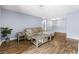 Inviting living room with wood floors, a comfortable couch, and fresh paint at 3151 Soaring Gulls Dr # 1062, Las Vegas, NV 89128