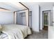This main bedroom features neutral gray carpet, canopy bed, closet and ensuite bathroom at 3151 Soaring Gulls Dr # 1062, Las Vegas, NV 89128