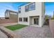 Backyard featuring brick pavers and artificial turf at 3712 Gilmore Creek St, Las Vegas, NV 89129