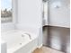 Corner soaking tub with adjacent windows to the Primary bedroom at 3712 Gilmore Creek St, Las Vegas, NV 89129