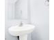Half-bath featuring a sleek pedestal sink and modern fixtures at 3712 Gilmore Creek St, Las Vegas, NV 89129