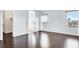 Spacious bedroom boasts hardwood floors and natural light from two large windows at 3712 Gilmore Creek St, Las Vegas, NV 89129