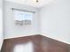 Light-filled bedroom featuring a large window and sleek hardwood floors at 3712 Gilmore Creek St, Las Vegas, NV 89129