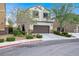 Charming two-story home features a well-kept lawn, desert landscaping, and attached garage at 3712 Gilmore Creek St, Las Vegas, NV 89129