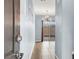 Inviting foyer with tile flooring and a modern light fixture leads to the outdoor patio at 3712 Gilmore Creek St, Las Vegas, NV 89129