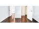 Bright hallway featuring hardwood floors, neutral paint, and crisp white doors and trim at 3712 Gilmore Creek St, Las Vegas, NV 89129