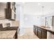 Contemporary kitchen featuring sleek countertops and a view of the dining area at 3712 Gilmore Creek St, Las Vegas, NV 89129