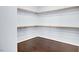 Spacious walk-in closet with hardwood floors and ample shelving at 3712 Gilmore Creek St, Las Vegas, NV 89129