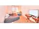 This is a simple bedroom with a bed, small table and television set on a table at 4145 Plumtree St, Las Vegas, NV 89115