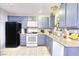 Bright kitchen featuring neutral walls, and tile flooring at 4145 Plumtree St, Las Vegas, NV 89115