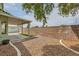 A spacious backyard with drought tolerant landscaping and a covered patio, perfect for low-maintenance living at 4318 Scarlet Vista Ct, North Las Vegas, NV 89031