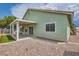 A spacious backyard featuring desert landscaping and a covered patio area at 4318 Scarlet Vista Ct, North Las Vegas, NV 89031
