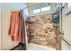 Tiled shower in bathroom features built-in seat and handrails at 4318 Scarlet Vista Ct, North Las Vegas, NV 89031