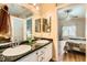 Bathroom featuring dual sinks and a door to bedroom at 4318 Scarlet Vista Ct, North Las Vegas, NV 89031