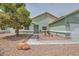 Charming single-story home featuring desert landscaping, and neutral toned stucco exterior at 4318 Scarlet Vista Ct, North Las Vegas, NV 89031