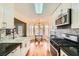 Bright kitchen features granite counters, mosaic backsplash, and stainless steel appliances at 4318 Scarlet Vista Ct, North Las Vegas, NV 89031