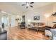 A bright living room offers plenty of space with hardwood floors, and a ceiling fan at 4318 Scarlet Vista Ct, North Las Vegas, NV 89031