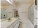 Bathroom features a sink, toilet, shelves, shower, and washer/dryer combo at 4391 Gannet Cir # 16, Las Vegas, NV 89103