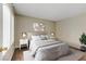 Virtually staged bedroom boasts natural light, hardwood floors, and modern decor at 4391 Gannet Cir # 16, Las Vegas, NV 89103