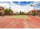Community tennis courts surrounded by lush landscaping and condo buildings at 4391 Gannet Cir # 16, Las Vegas, NV 89103