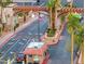 Community entrance with a guard house, palm trees, and lush landscaping at 4421 Alexis Dr # 429, Las Vegas, NV 89103