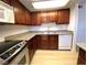 Well-equipped kitchen featuring stainless steel appliances, dark cabinetry, and a tile backsplash at 4421 Alexis Dr # 429, Las Vegas, NV 89103