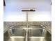 Close up of stainless steel dual sink with modern, motion-activated faucet at 4421 Alexis Dr # 429, Las Vegas, NV 89103