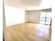 Spacious living room with neutral walls, hardwood floors, and sliding glass doors to balcony at 4421 Alexis Dr # 429, Las Vegas, NV 89103
