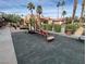 Community playground with swings and slide for neighborhood enjoyment at 4421 Alexis Dr # 429, Las Vegas, NV 89103