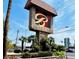 Bella Vita sign with lush landscaping and palm trees in front of high rise buildings at 4421 Alexis Dr # 429, Las Vegas, NV 89103