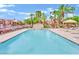 Relaxing swimming pool area with mature trees and comfortable lounge chairs create a perfect oasis at 4421 Alexis Dr # 429, Las Vegas, NV 89103