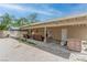 Wide open backyard area with partially covered patio area with outdoor seating at 4739 Glenndavis Dr, Las Vegas, NV 89121