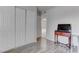 Bedroom with closet, adjacent room, and a television on a console table at 4739 Glenndavis Dr, Las Vegas, NV 89121