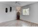 Bedroom showcasing a fan, a window and laminate floors at 4739 Glenndavis Dr, Las Vegas, NV 89121