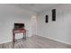 Bedroom featuring laminate floors, wall decor, a television, and a side table at 4739 Glenndavis Dr, Las Vegas, NV 89121