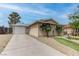 Charming single-story home with a driveway, a one-car garage and desert landscaping at 4739 Glenndavis Dr, Las Vegas, NV 89121