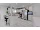 Kitchen with white cabinets, stainless steel appliances, granite countertops, and tile flooring at 4739 Glenndavis Dr, Las Vegas, NV 89121