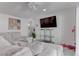 Bright living room featuring a large sectional sofa and entertainment center at 4739 Glenndavis Dr, Las Vegas, NV 89121