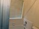 Clean bathroom featuring a white tiled bathtub and shower combination with a curtain at 4833 Lawnwood Ct, Las Vegas, NV 89130