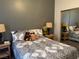 Cozy bedroom with decorative bedding, side tables, and mirrored closet, creating a comfortable space at 4833 Lawnwood Ct, Las Vegas, NV 89130