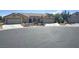 Well-maintained exterior featuring a two-car garage, desert landscaping, and a circular driveway, enhancing curb appeal at 4833 Lawnwood Ct, Las Vegas, NV 89130