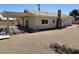Expansive backyard with a covered patio and low-maintenance gravel landscaping at 5030 Salinaz Cir, Las Vegas, NV 89118