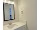 This is a bathroom sink and mirror at 5030 Salinaz Cir, Las Vegas, NV 89118