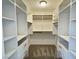 Walk-in closet with multiple shelves and drawers for organized storage solutions at 5030 Salinaz Cir, Las Vegas, NV 89118