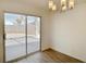 Dining room showcasing modern lighting and sliding glass doors leading to a patio area at 5030 Salinaz Cir, Las Vegas, NV 89118
