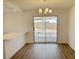 Bright dining room with laminate floors and a sliding glass door at 5030 Salinaz Cir, Las Vegas, NV 89118