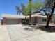 Charming single-story home featuring a brick accent and two-car garage at 5030 Salinaz Cir, Las Vegas, NV 89118