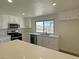 Bright kitchen with stainless steel appliances and white countertops at 5030 Salinaz Cir, Las Vegas, NV 89118