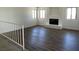 Spacious living room with new laminate flooring and a brick fireplace at 5030 Salinaz Cir, Las Vegas, NV 89118