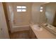 Well-lit bathroom features a separate tub and shower, and a vanity with white sink at 5125 W Reno Ave # 1059, Las Vegas, NV 89118